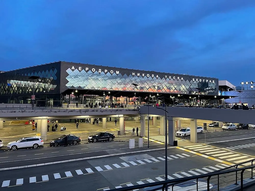Returning a rental car in front of Belgrade Nikola Tesla Airport terminal