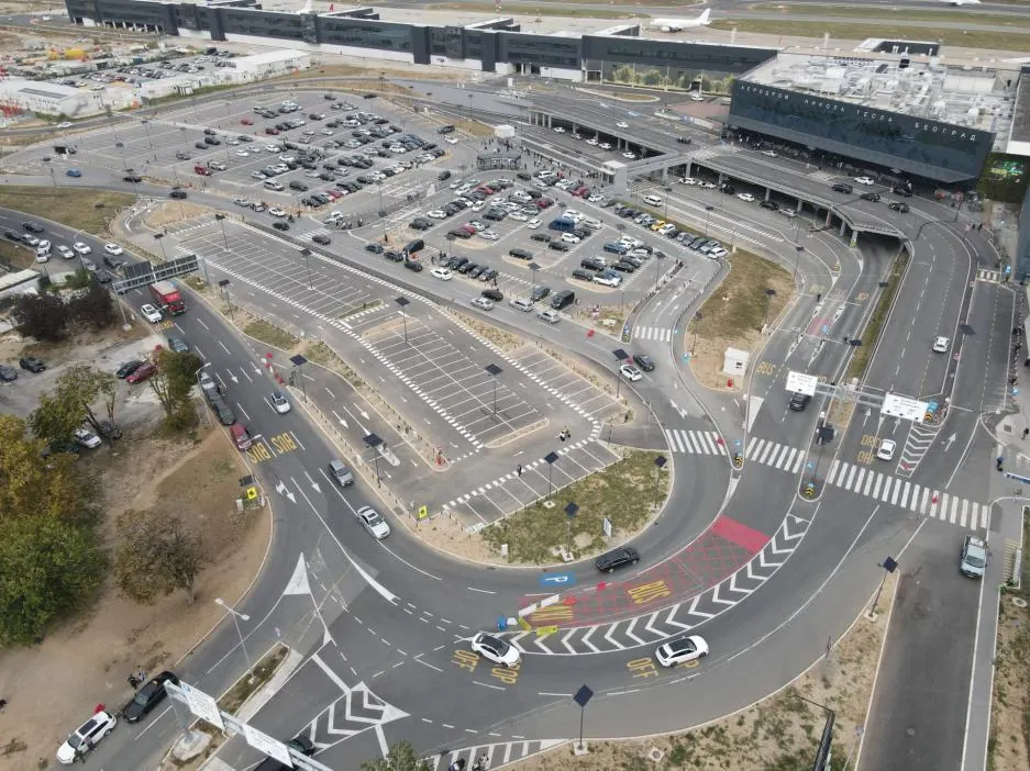 Aerial view of parking and terminal access roads at Belgrade Nikola Tesla Airport